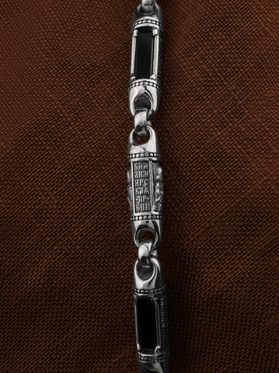 Гайтан из белого золота c кожаным шнурком и ониксом